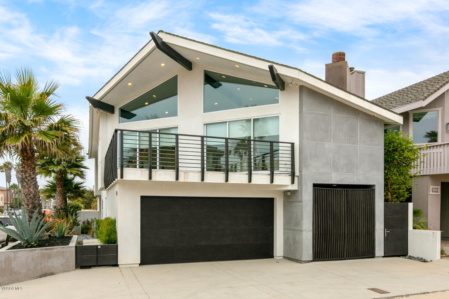 950 Mandalay Beach Road Oxnard, CA 93035 - Photo 3 of 53 a front view of a house with a yard
