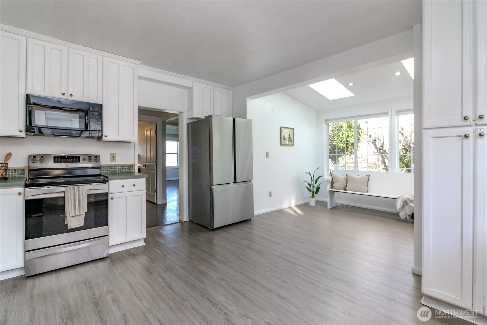 1514 Rainier Street Steilacoom, WA 98388 - Photo 17 of 37 a kitchen with stainless steel appliances a stove a refrigerator and a microwave