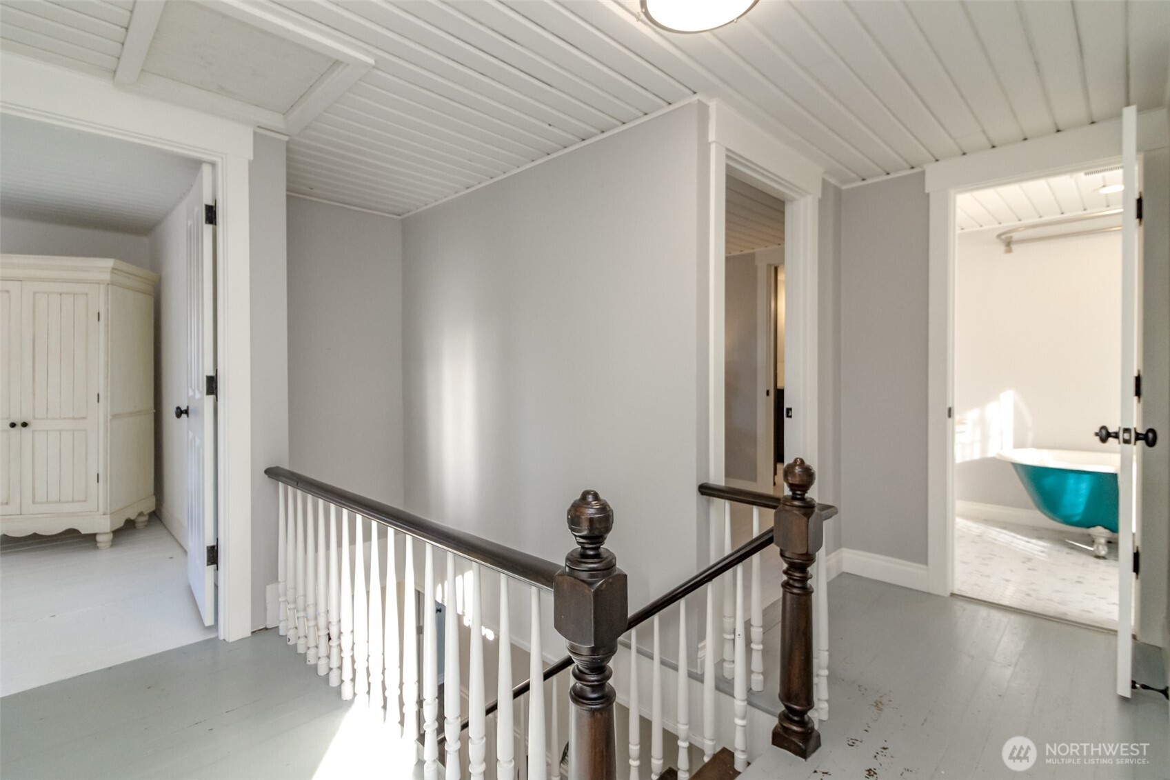 1514 Rainier Street Steilacoom, WA 98388 - Photo 18 of 37 a view of a hallway with wooden floor and stairs