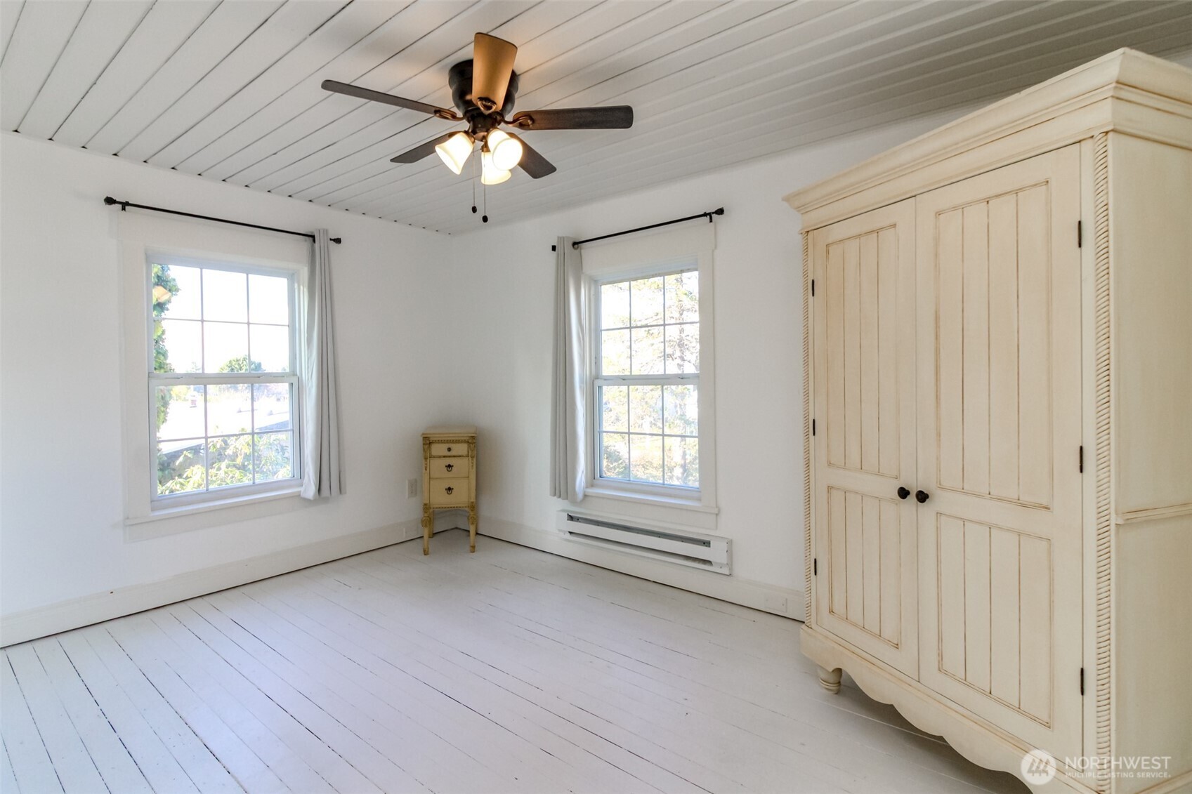 1514 Rainier Street Steilacoom, WA 98388 - Photo 24 of 37 an empty room with chandelier fan and windows