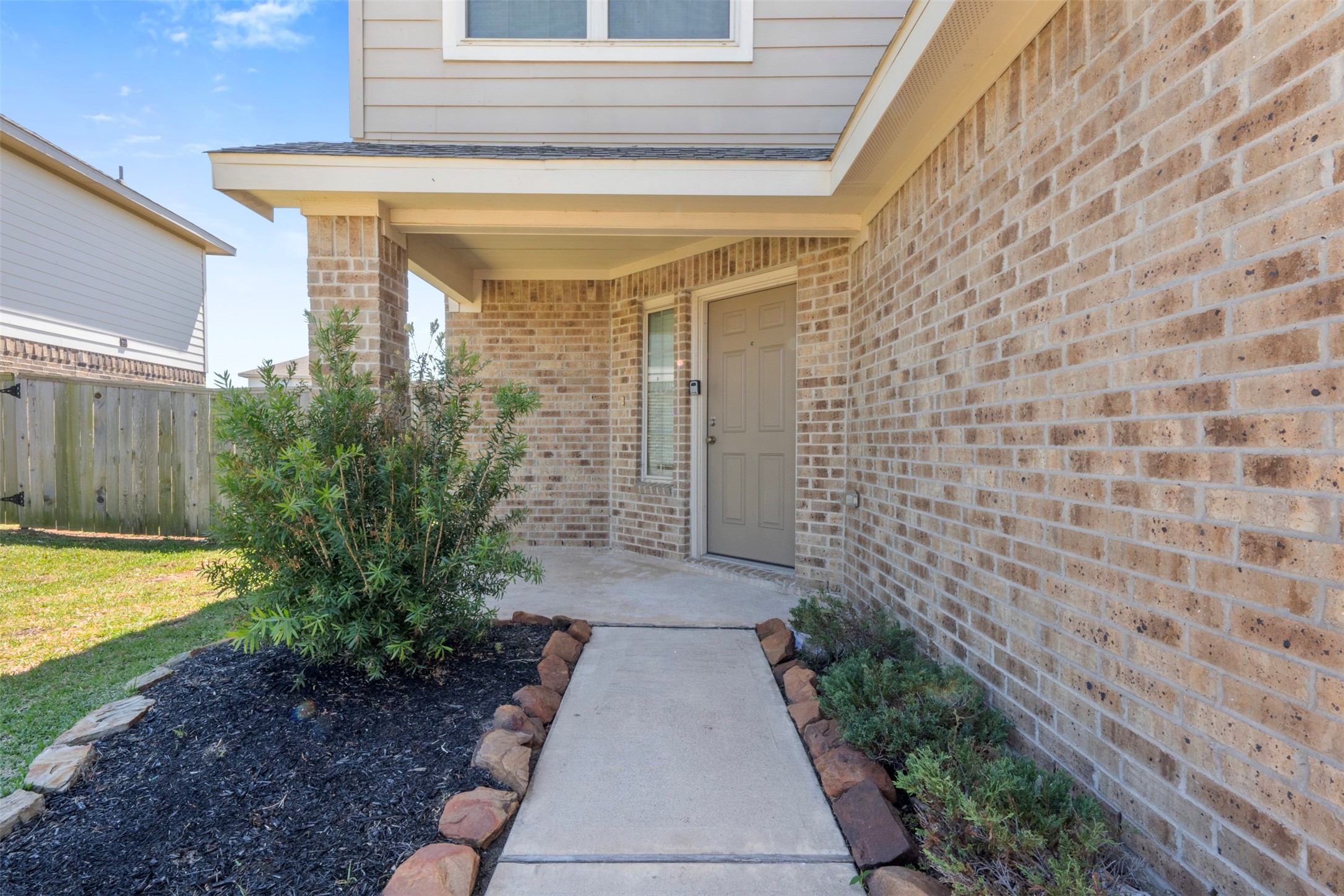 14602 Broadbury Pond Road Rosharon, TX 77583 - Photo 2 of 22 a view of a pathway with a house in the background