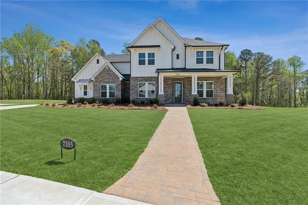 a front view of a house with a yard