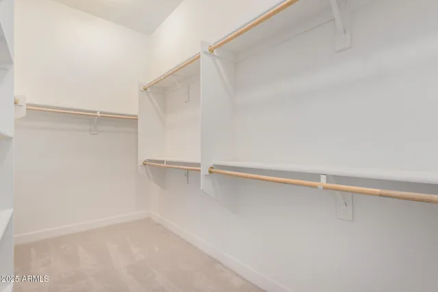 a view of an empty walk in closet