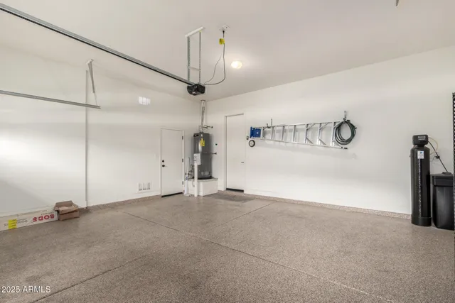 an empty room with a view of a garage