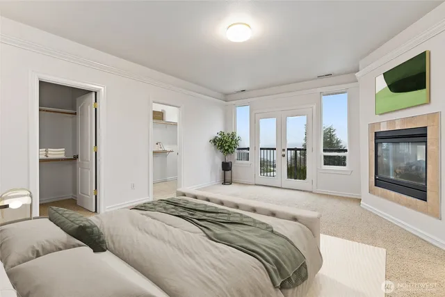 a bedroom with a balcony a bed and a television