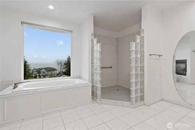 a bathroom with a shower a toilet and a shower