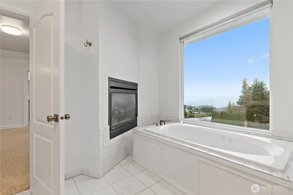 a bathroom with a shower a toilet and a shower
