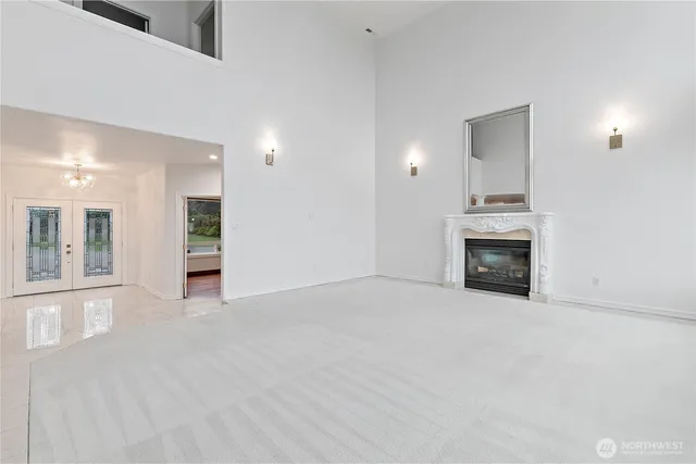 a view of empty room with a fireplace