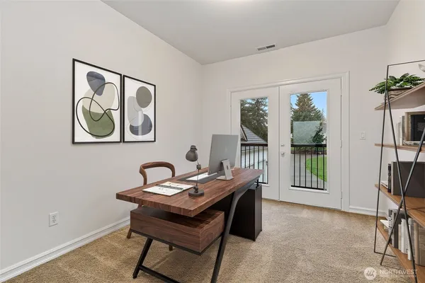 a bedroom with a large bed and a window