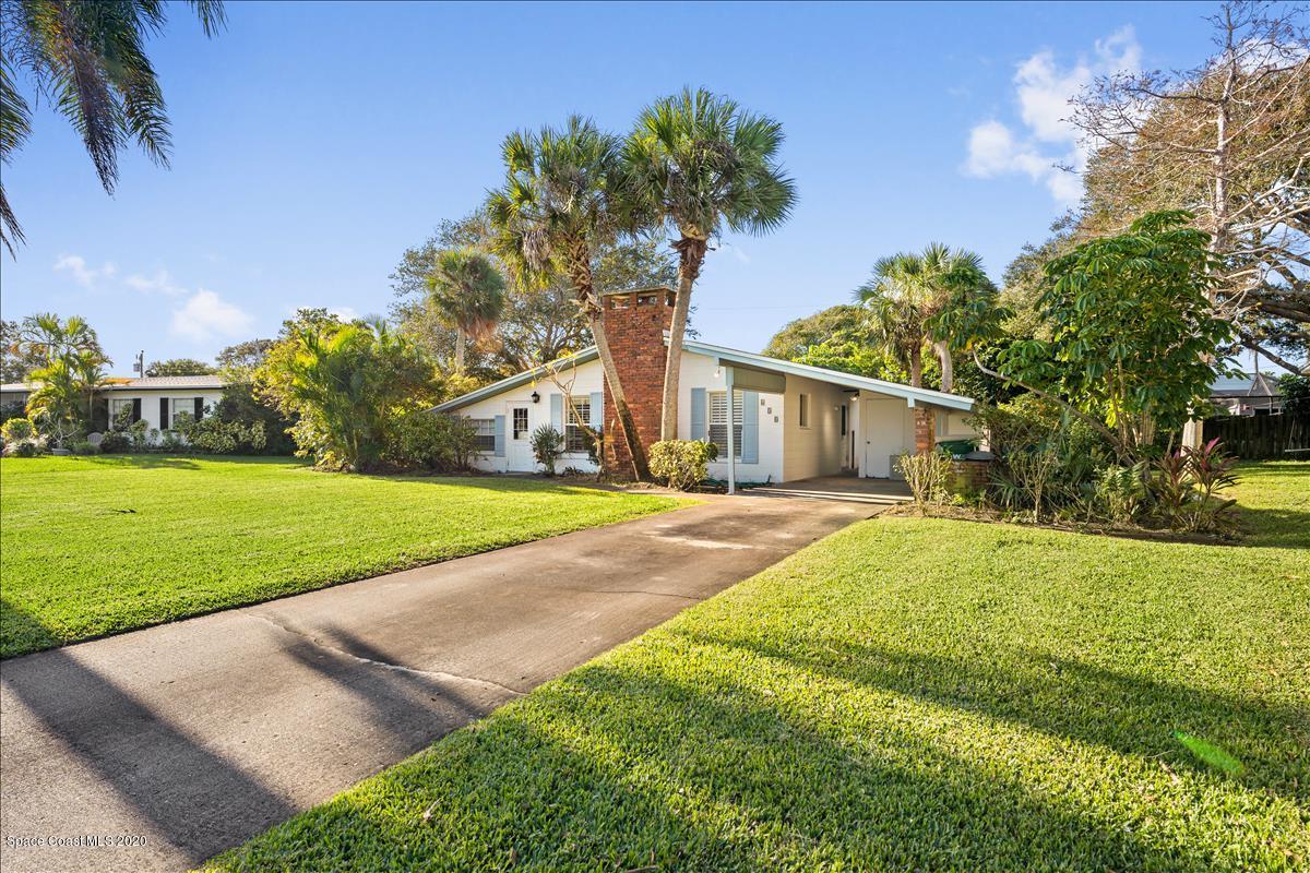 650 Java Road Cocoa Beach, FL 32931 - Photo 12 of 39 a house with garden in front of it