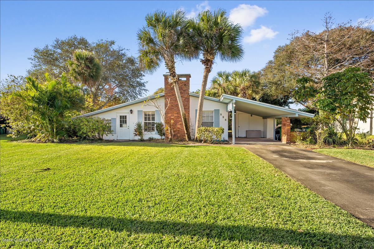 650 Java Road Cocoa Beach, FL 32931 - Photo 13 of 39 a front view of house with yard and green space