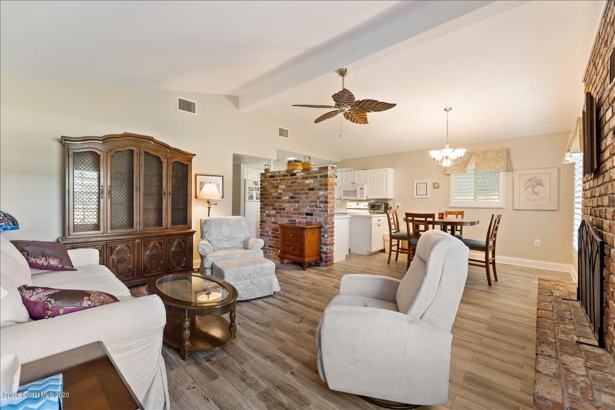 650 Java Road Cocoa Beach, FL 32931 - Photo 19 of 39 a living room with furniture and a wooden floor