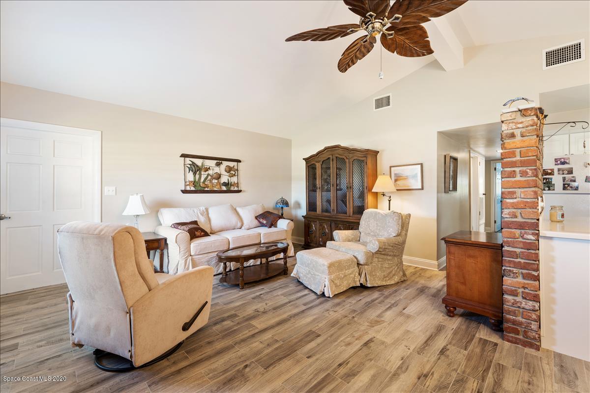 650 Java Road Cocoa Beach, FL 32931 - Photo 21 of 39 a living room with furniture and a wooden floor