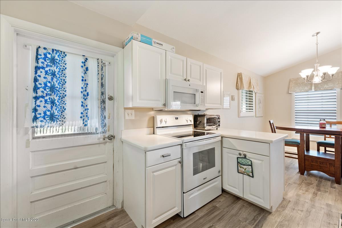 650 Java Road Cocoa Beach, FL 32931 - Photo 25 of 39 a kitchen with a stove oven and sink