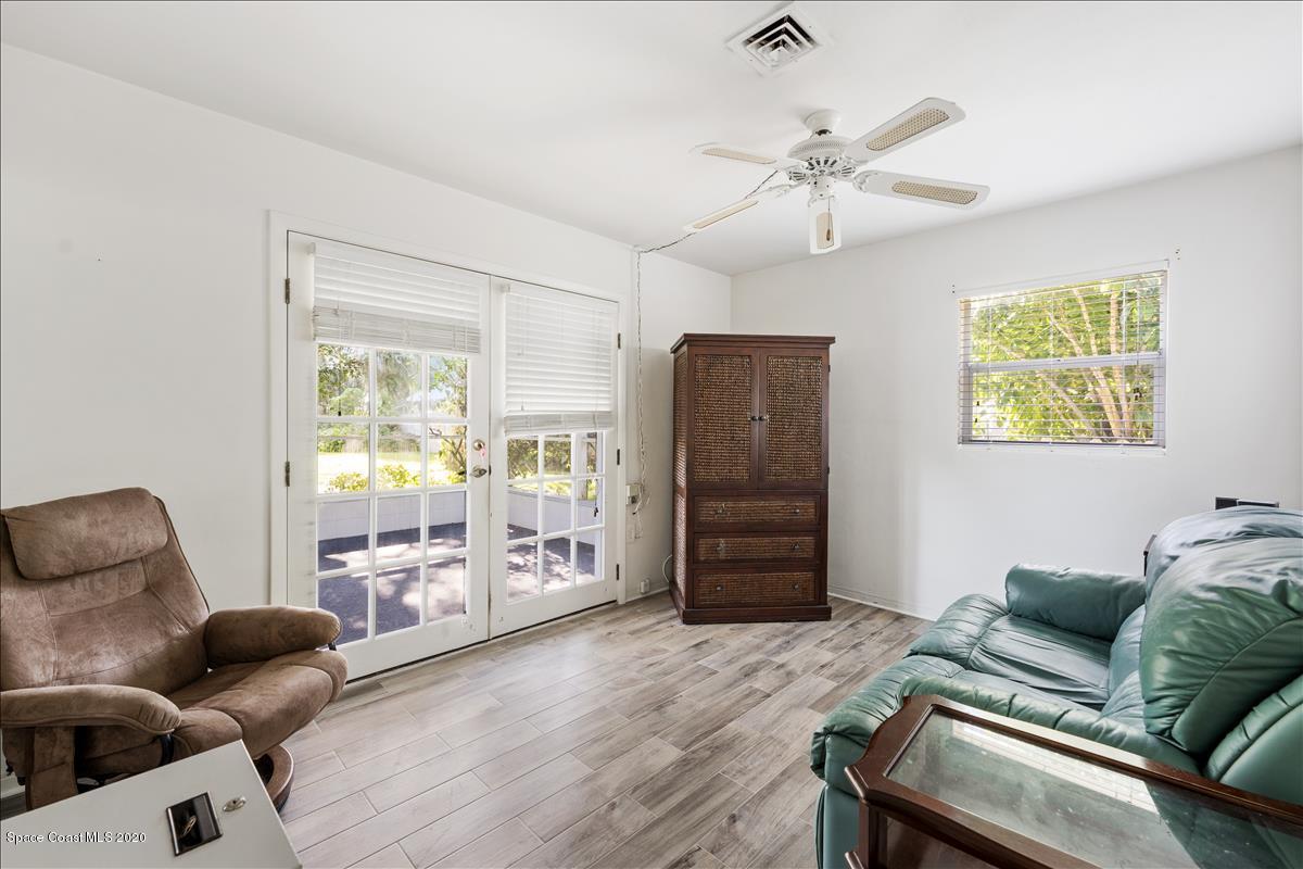 650 Java Road Cocoa Beach, FL 32931 - Photo 32 of 39 a living room with furniture and a window