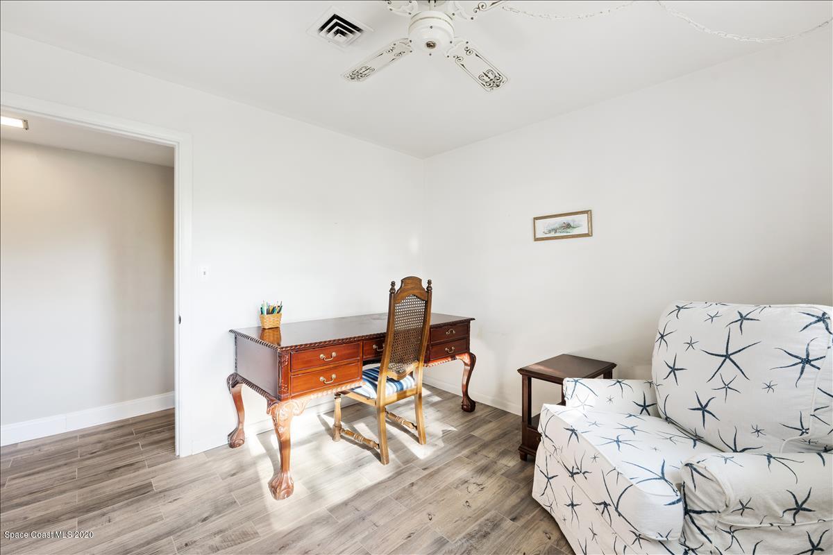 650 Java Road Cocoa Beach, FL 32931 - Photo 35 of 39 a workspace with furniture and wooden floor