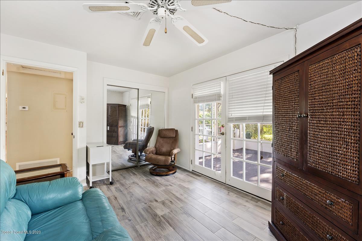 650 Java Road Cocoa Beach, FL 32931 - Photo 36 of 39 a living room with furniture and a flat screen tv