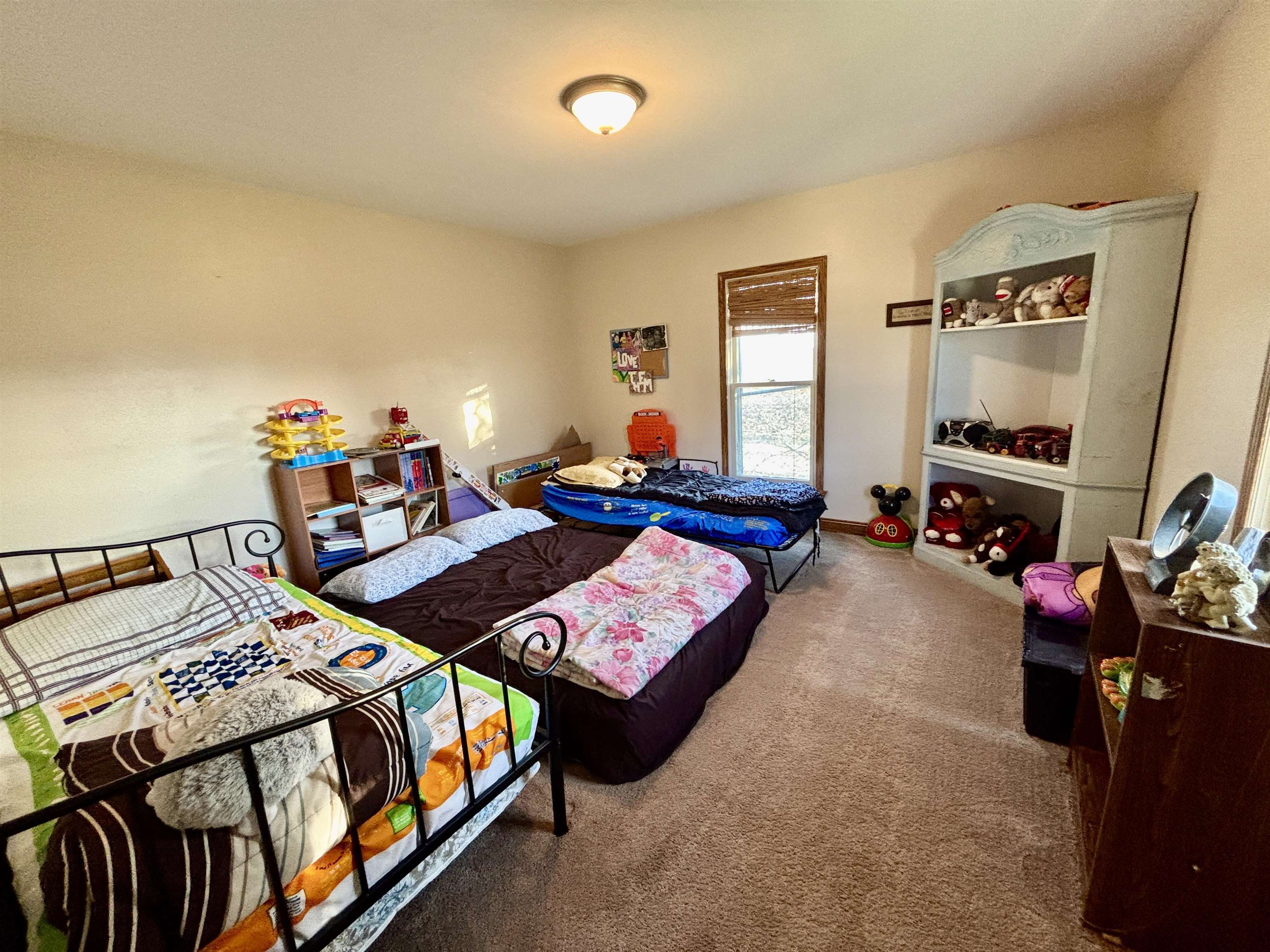 12916 Grange Hall Road Capron, IL 61012 - Photo 18 of 48 a bedroom with a bed closet and a window