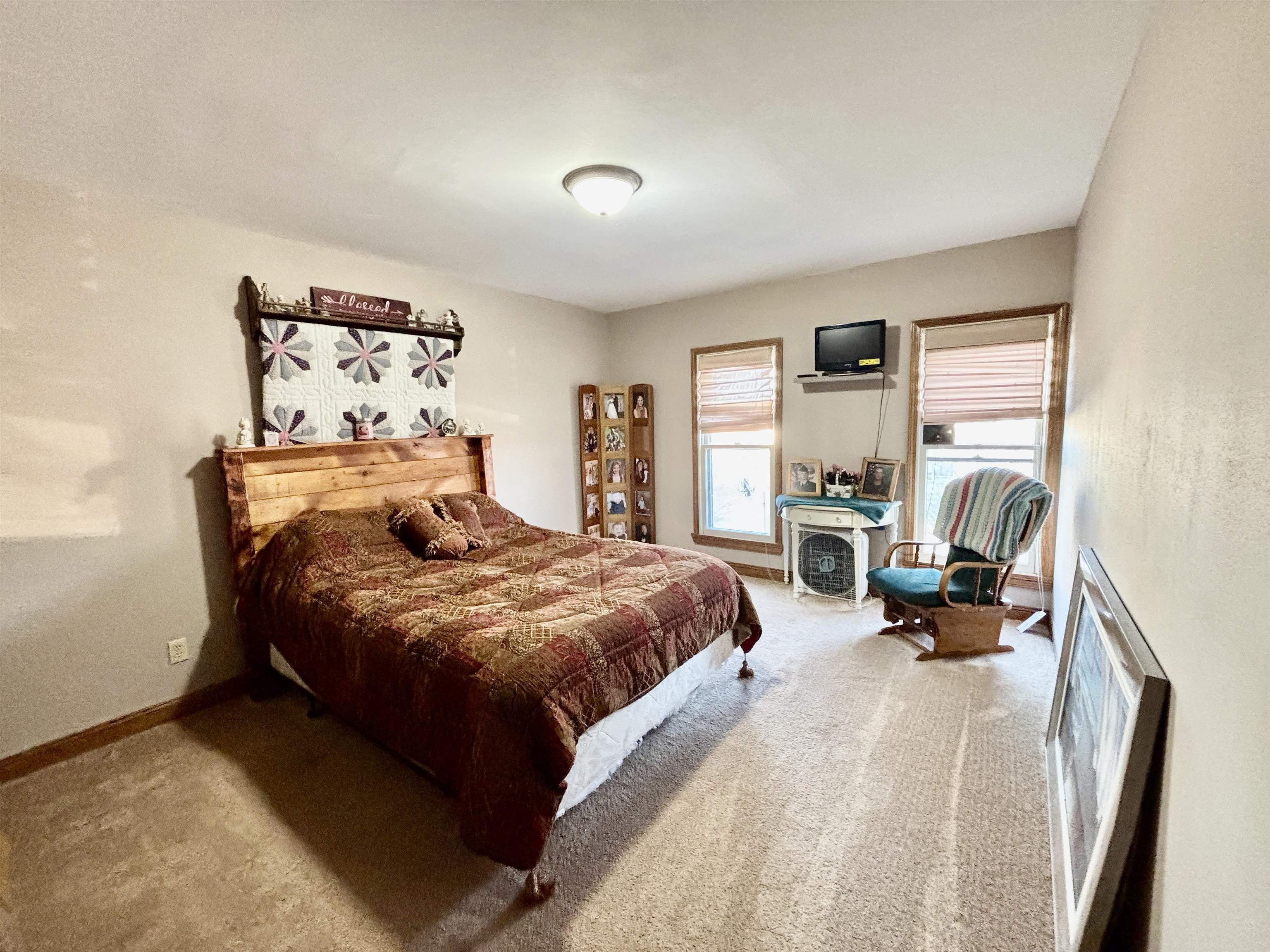 12916 Grange Hall Road Capron, IL 61012 - Photo 23 of 48 a bedroom with a bed and glass table