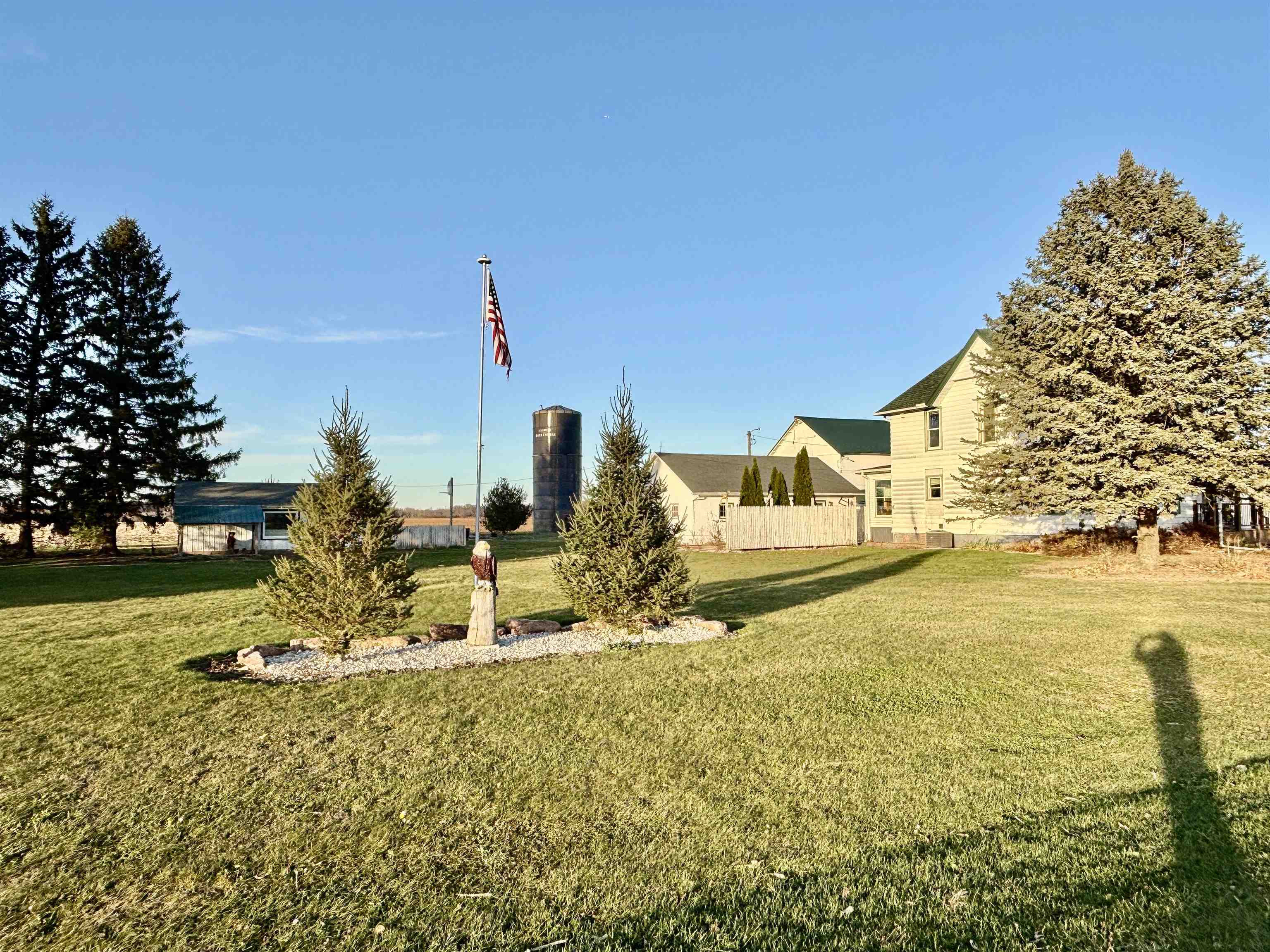12916 Grange Hall Road Capron, IL 61012 - Photo 3 of 48 a view of a lake with a house