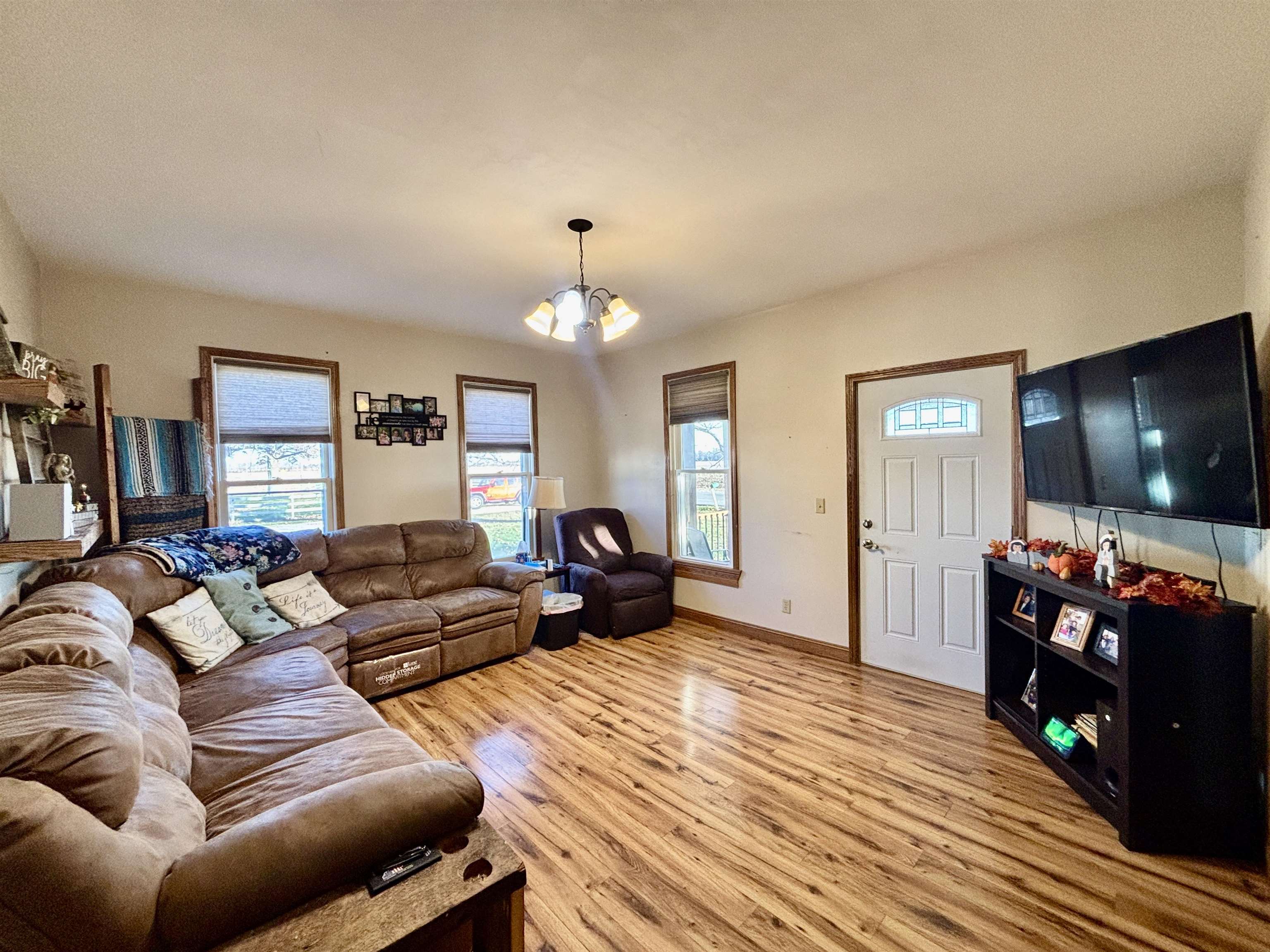 12916 Grange Hall Road Capron, IL 61012 - Photo 4 of 48 a living room with furniture and a flat screen tv