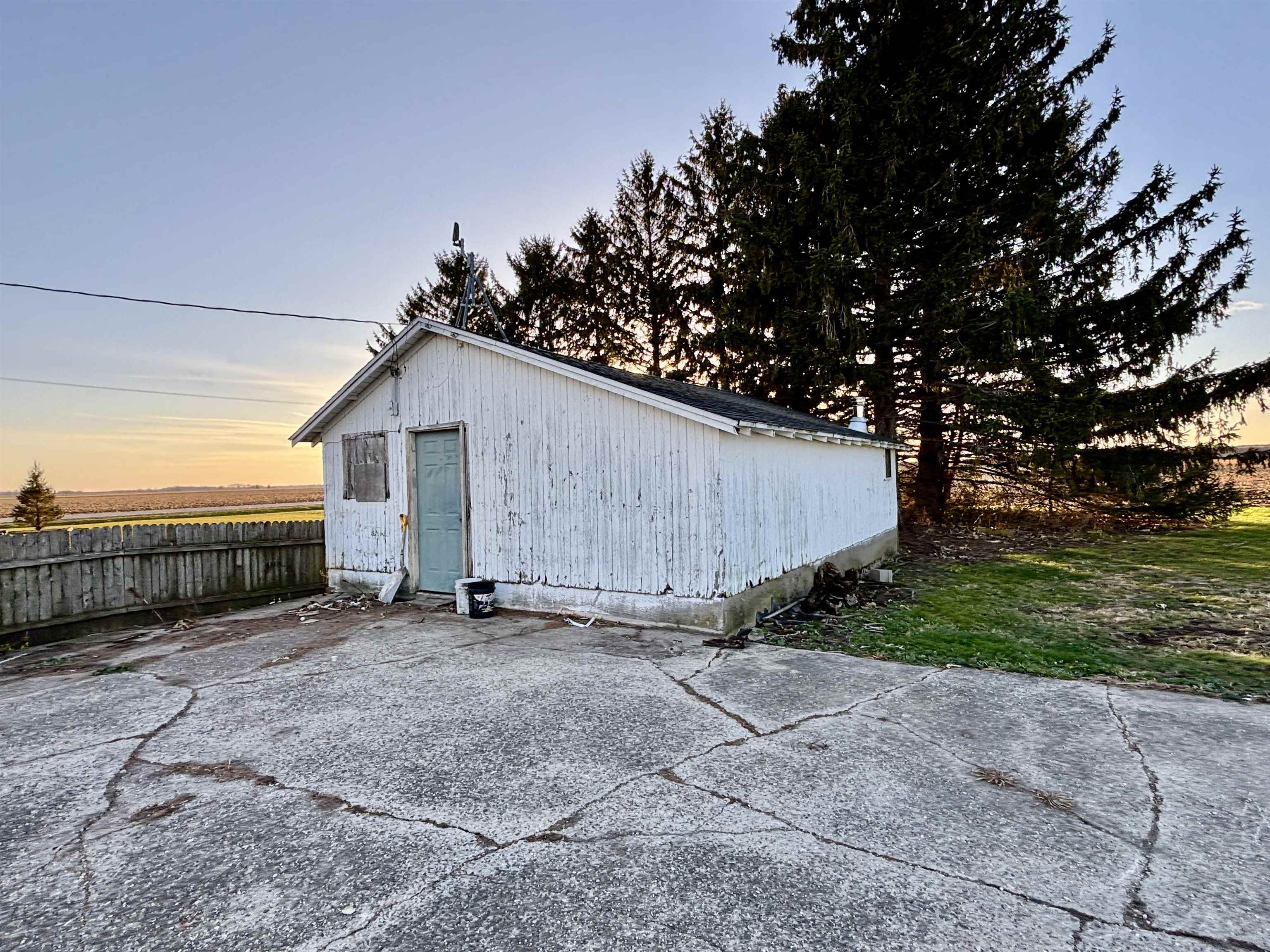 12916 Grange Hall Road Capron, IL 61012 - Photo 46 of 48 a view of a barn in a yard with wooden fence