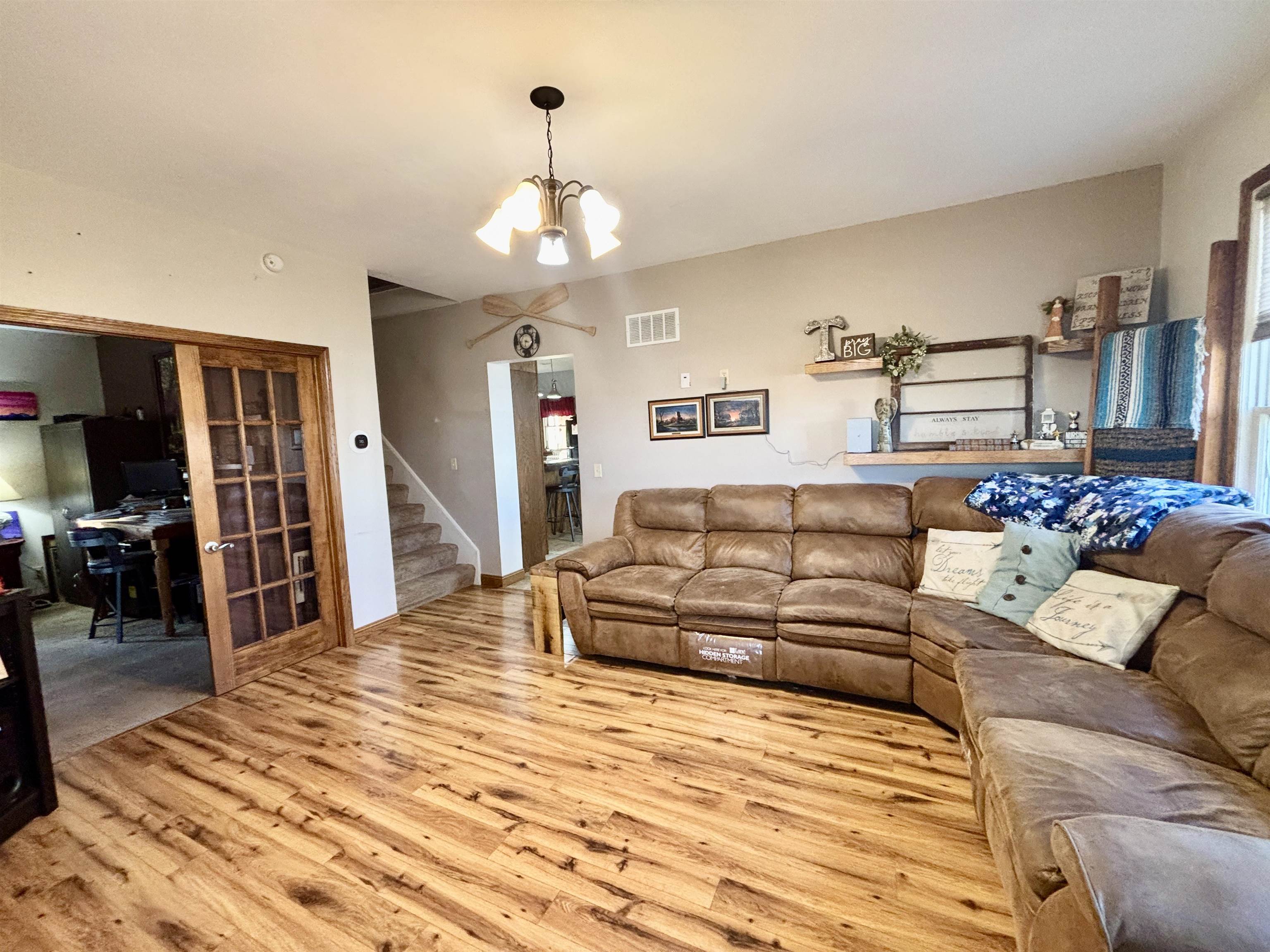 12916 Grange Hall Road Capron, IL 61012 - Photo 6 of 48 a living room with furniture and a chandelier