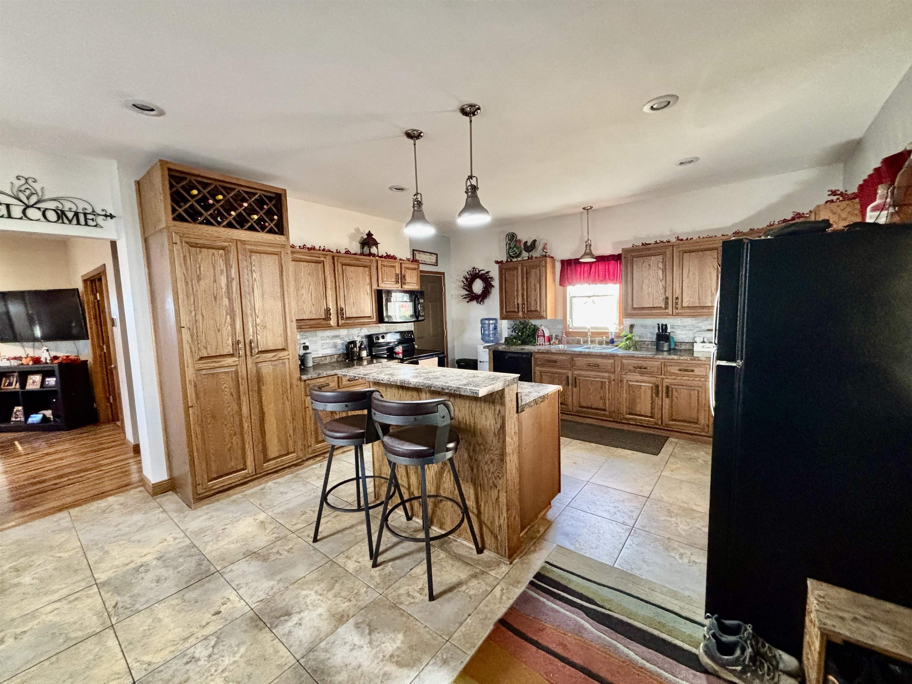 12916 Grange Hall Road Capron, IL 61012 - Photo 7 of 48 a kitchen with stainless steel appliances granite countertop a refrigerator and a sink