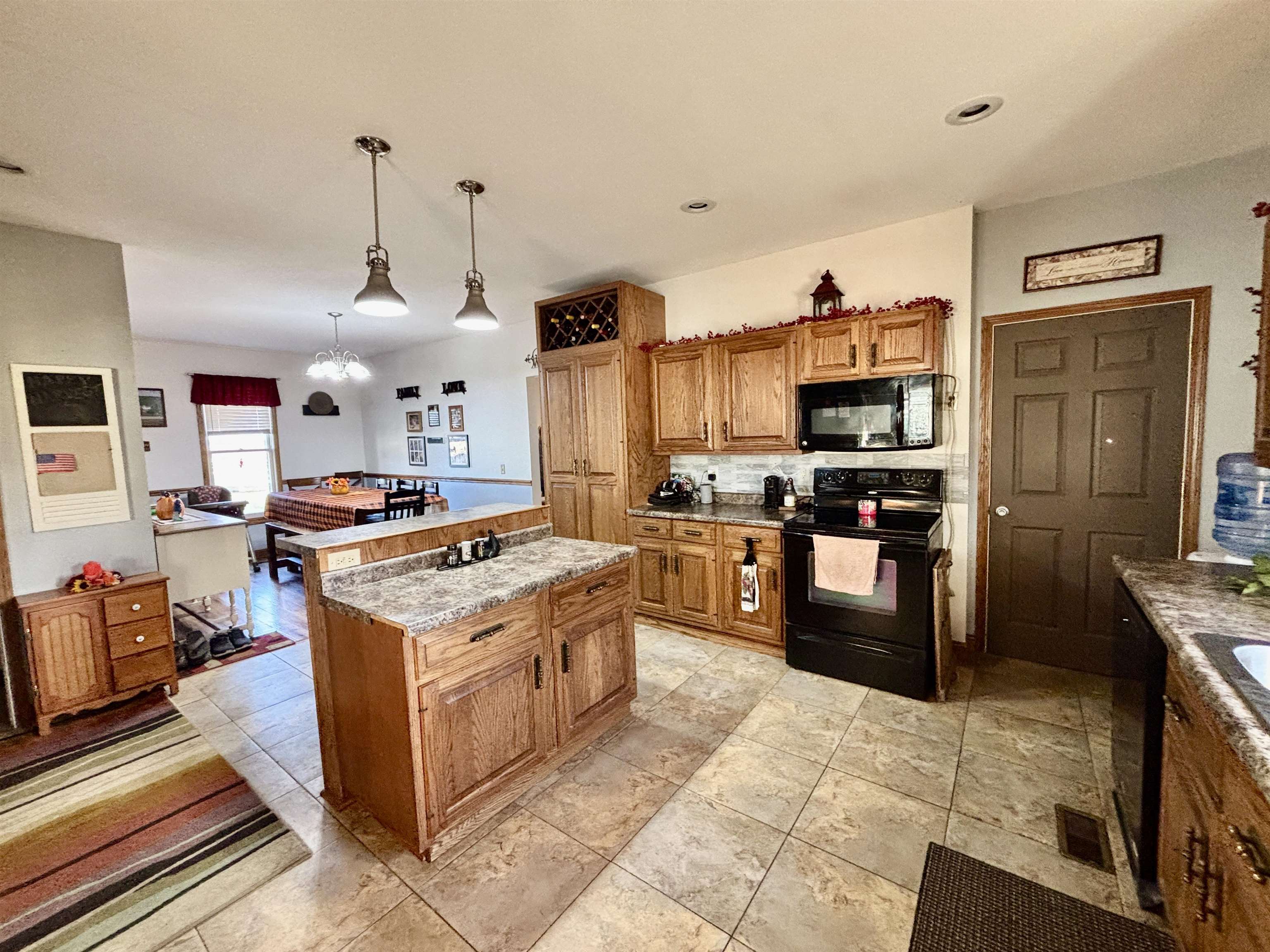 12916 Grange Hall Road Capron, IL 61012 - Photo 9 of 48 a kitchen with stainless steel appliances granite countertop a stove top oven a sink dishwasher and a refrigerator with the cabinets