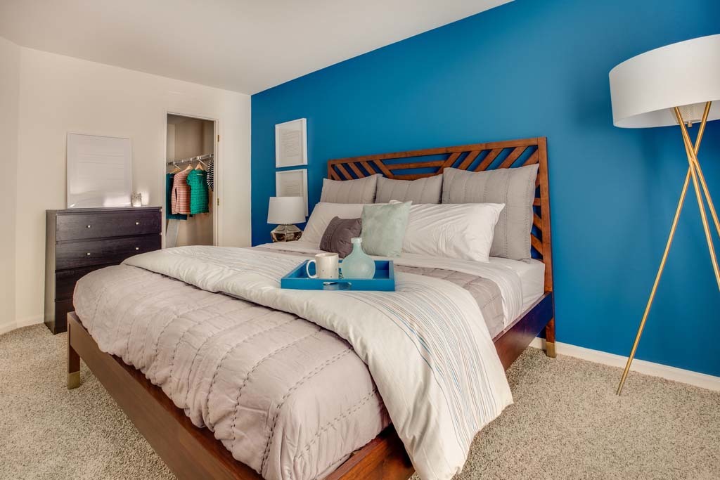 180 MacArthur Drive, Unit 5821 Willowbrook, IL 60527 - Photo 15 of 29 a bedroom with a bed and a lamp on dresser