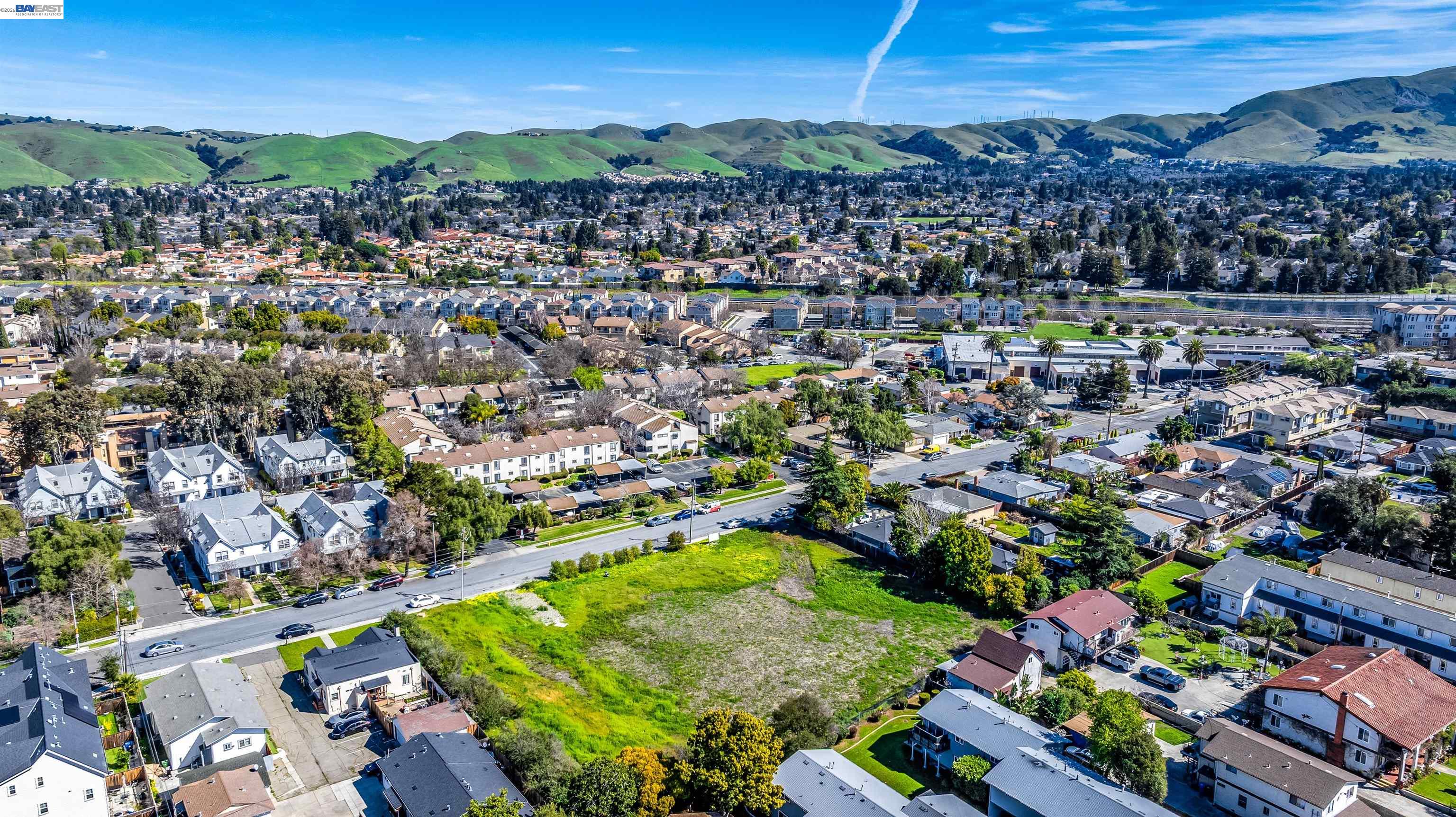 40871 High Street Fremont, CA 94538 - Photo 7 of 10 an aerial view of residential houses with outdoor space and parking