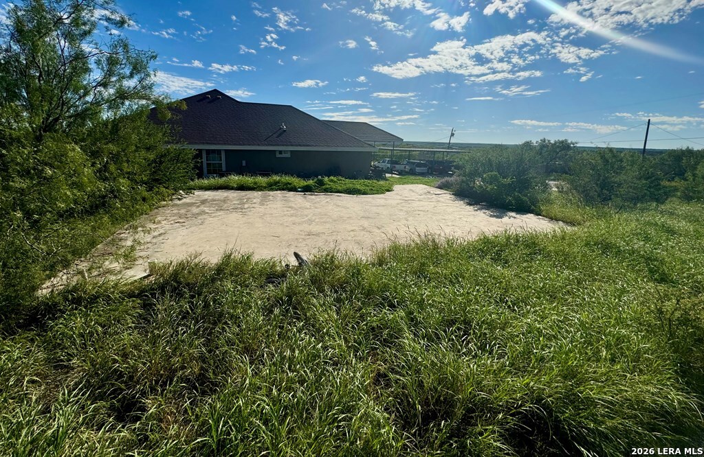 1881 Wagon Wheel Road Eagle Pass, TX 78852 - Photo 3 of 4 a view of a garden with an tree