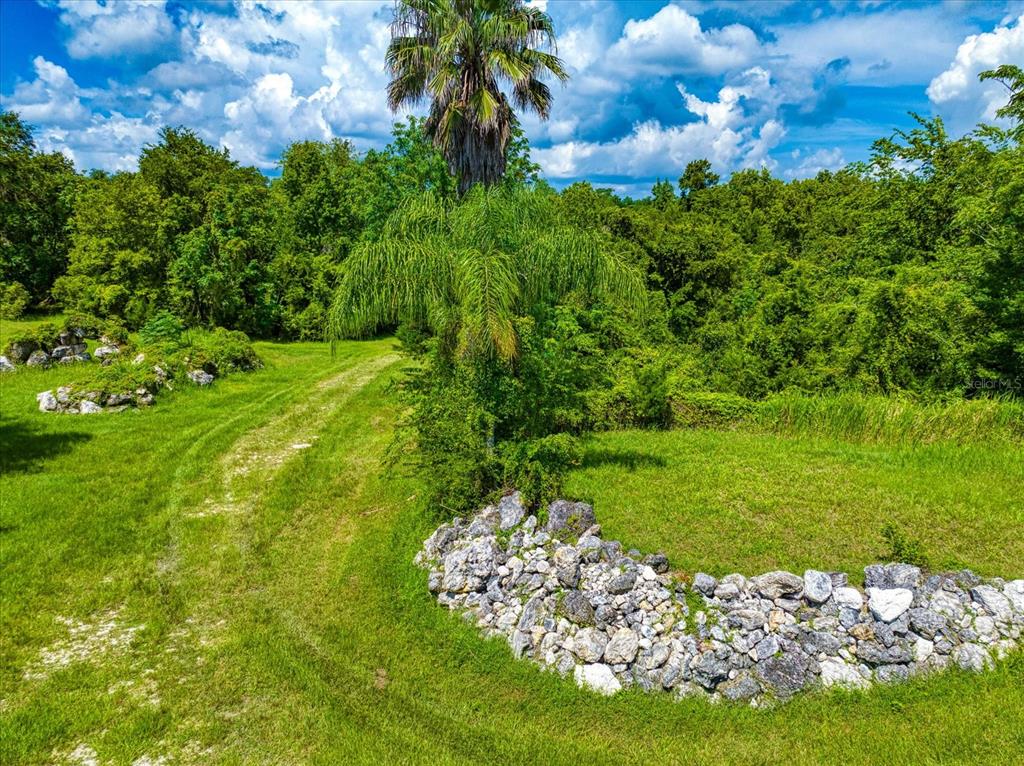 Trails throughout the 40 (MOL) acres with the natural rock borders, this property is captivating.