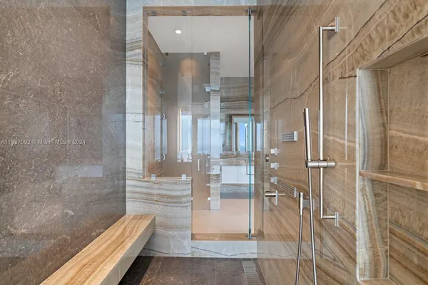 a bathroom with a bathtub and a shower