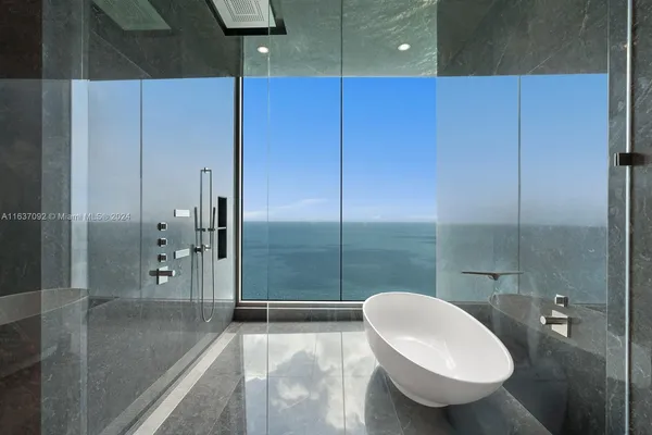 a white toilet sitting next to a white door