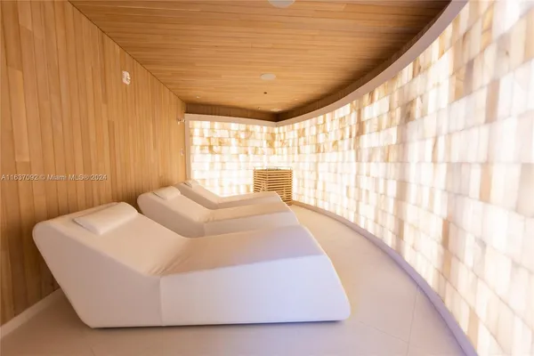 a room with furniture and a flat screen tv