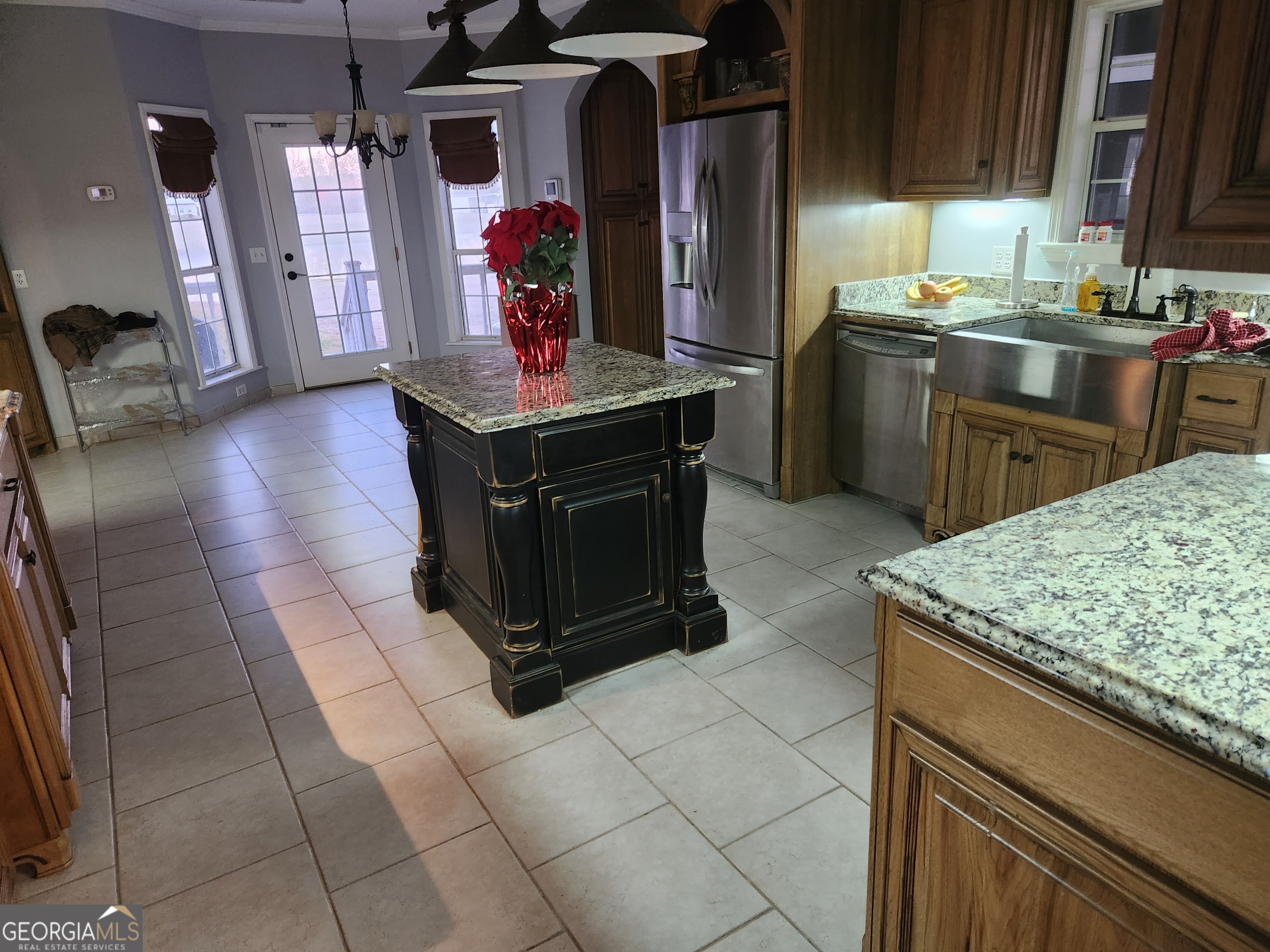 4262 Highway 15 Vidalia, GA 30474 - Photo 40 of 79 a kitchen with stainless steel appliances granite countertop a sink and a stove