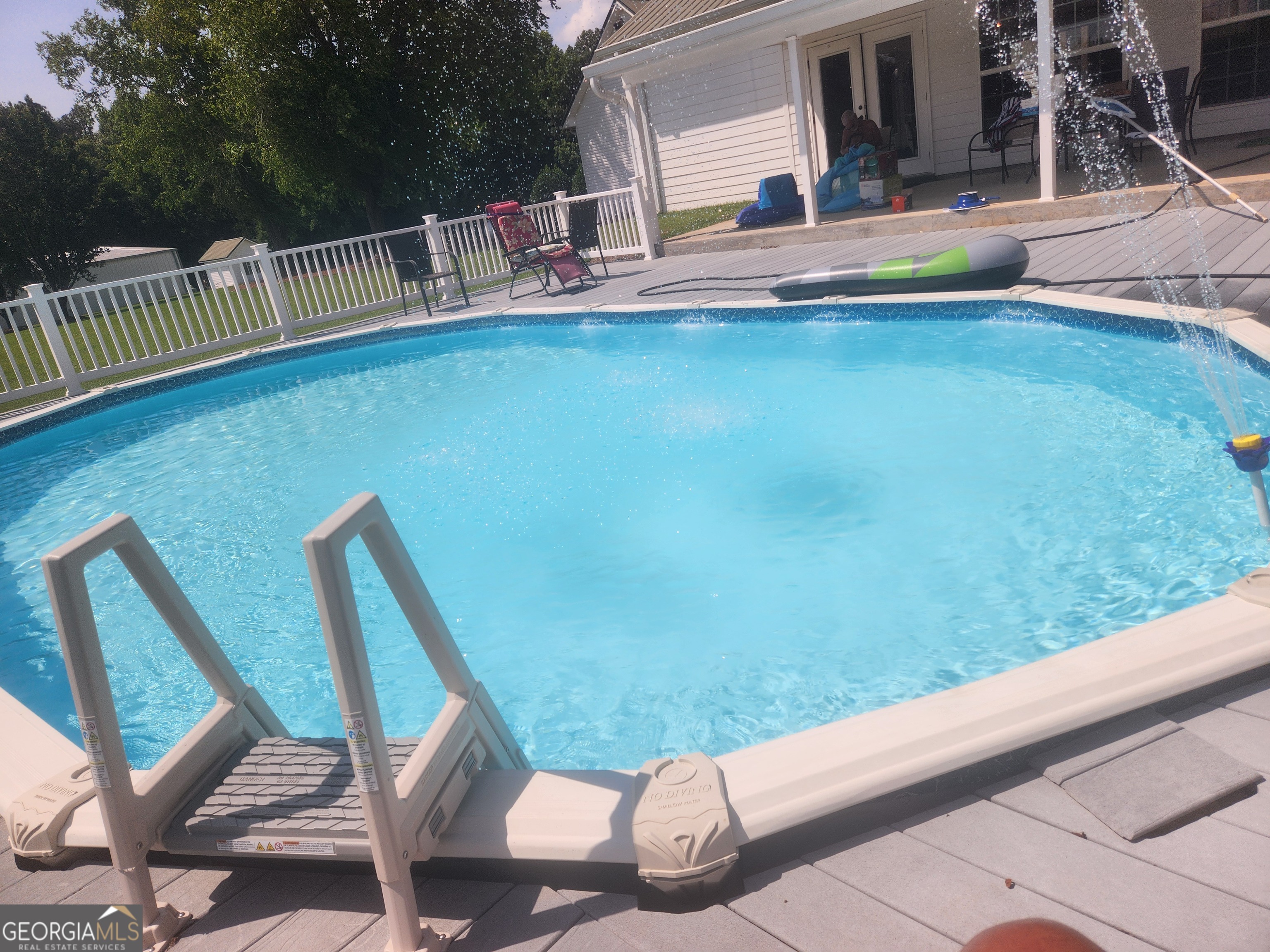 4262 Highway 15 Vidalia, GA 30474 - Photo 42 of 79 a view of a swimming pool with a lounge chair
