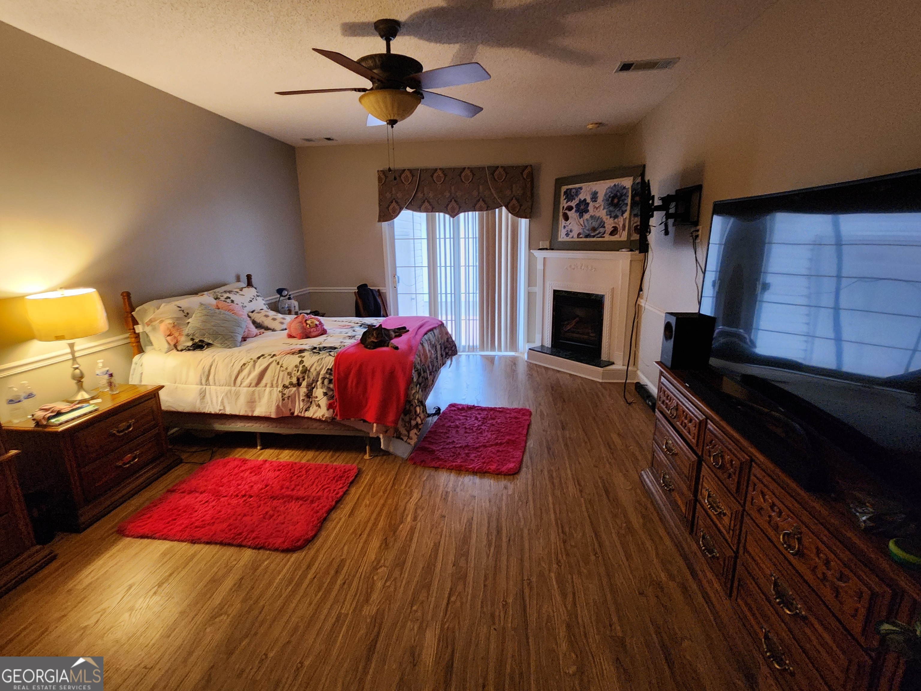 4262 Highway 15 Vidalia, GA 30474 - Photo 51 of 79 a bedroom with a bed and a fireplace
