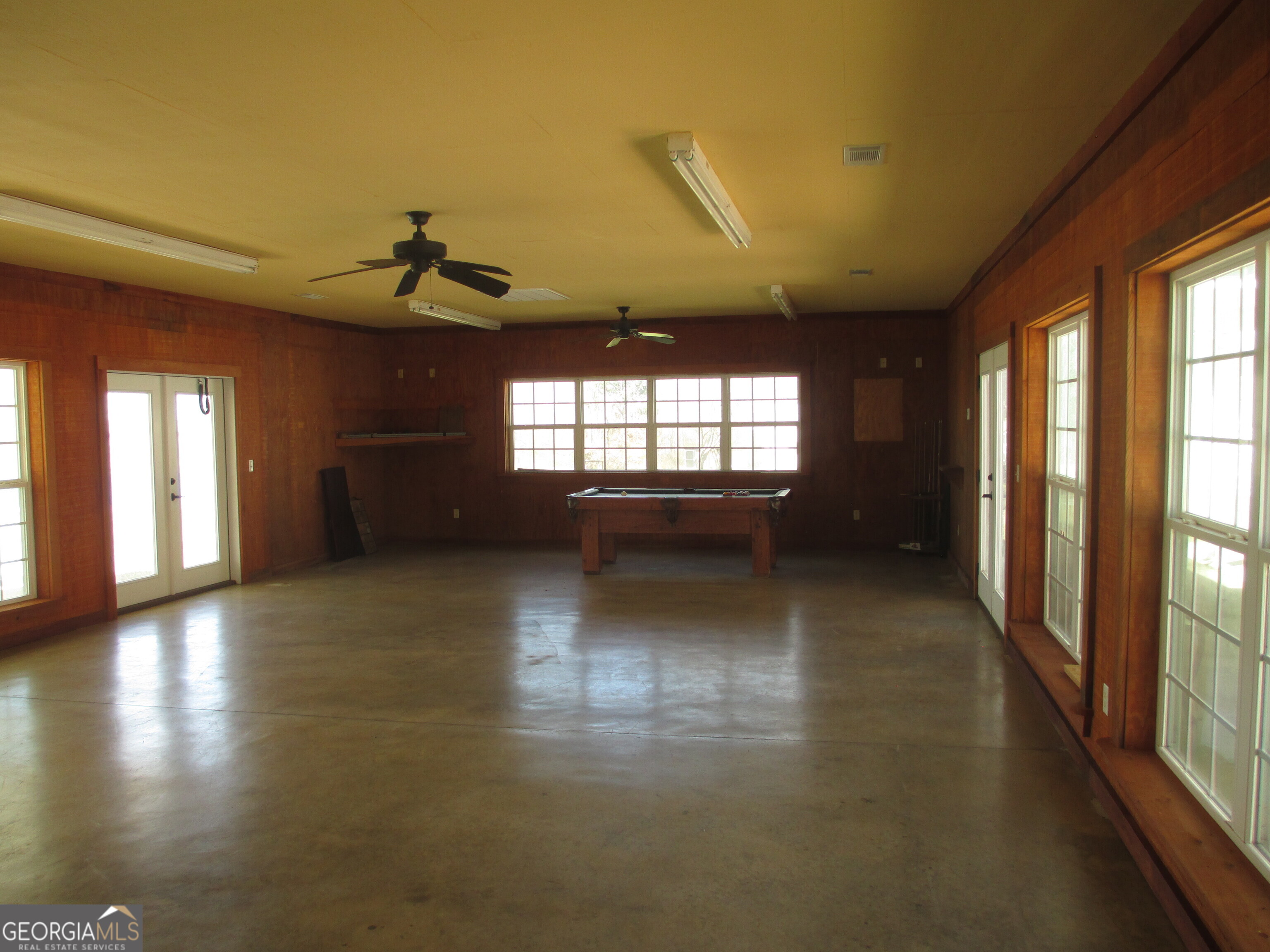 4262 Highway 15 Vidalia, GA 30474 - Photo 60 of 79 a view of empty room with wooden floor and fan