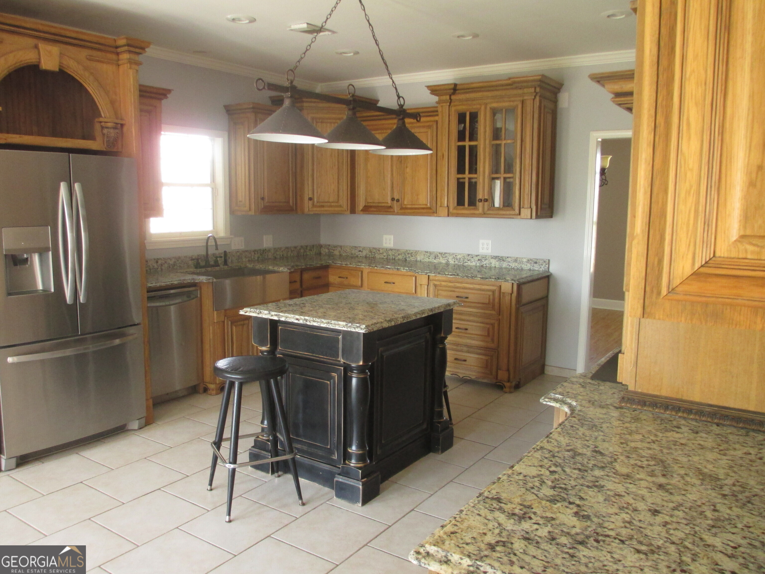 4262 Highway 15 Vidalia, GA 30474 - Photo 63 of 79 a kitchen with stainless steel appliances granite countertop a sink and a refrigerator