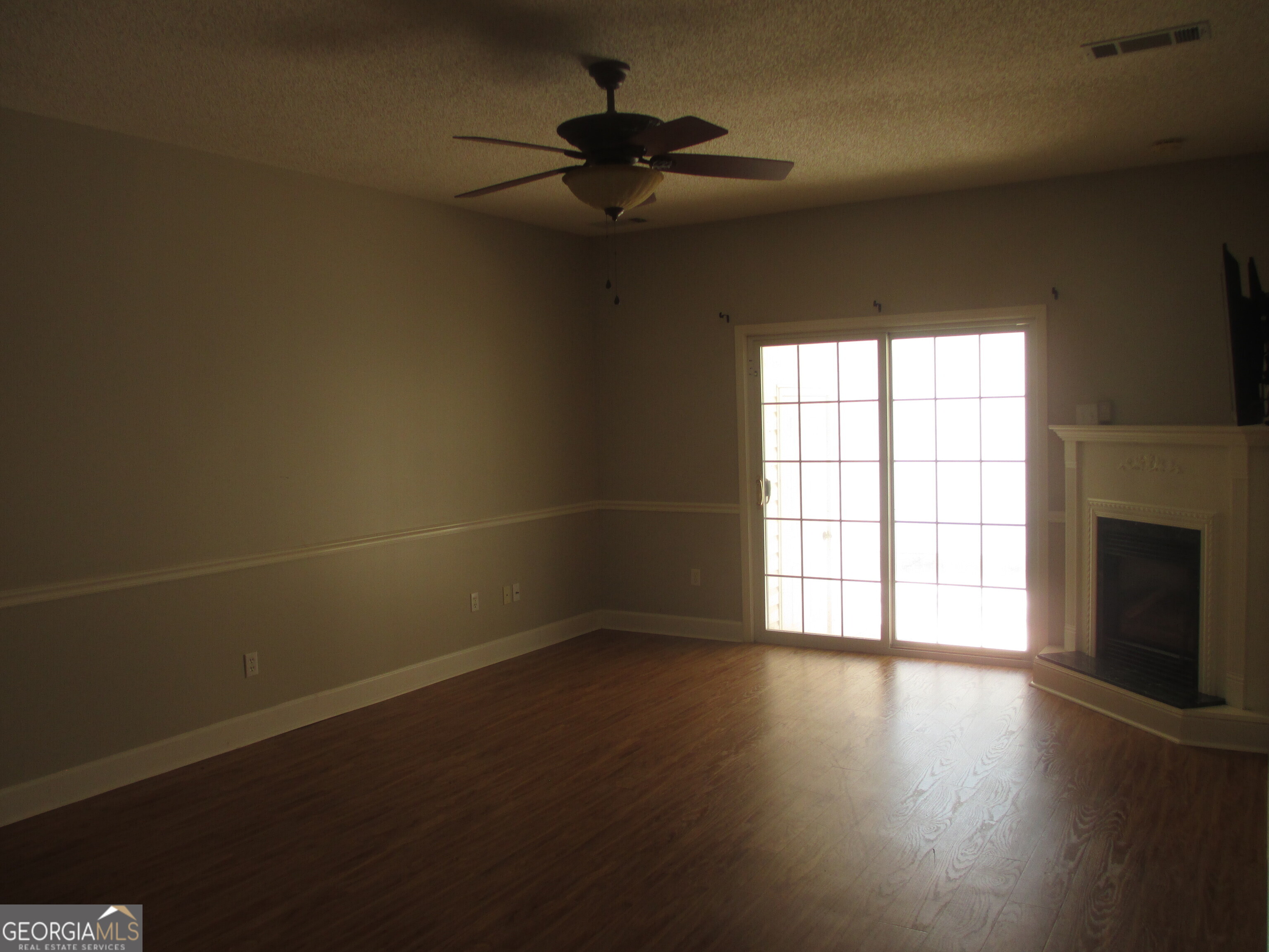 4262 Highway 15 Vidalia, GA 30474 - Photo 70 of 79 a view of an empty room with a window and wooden floor