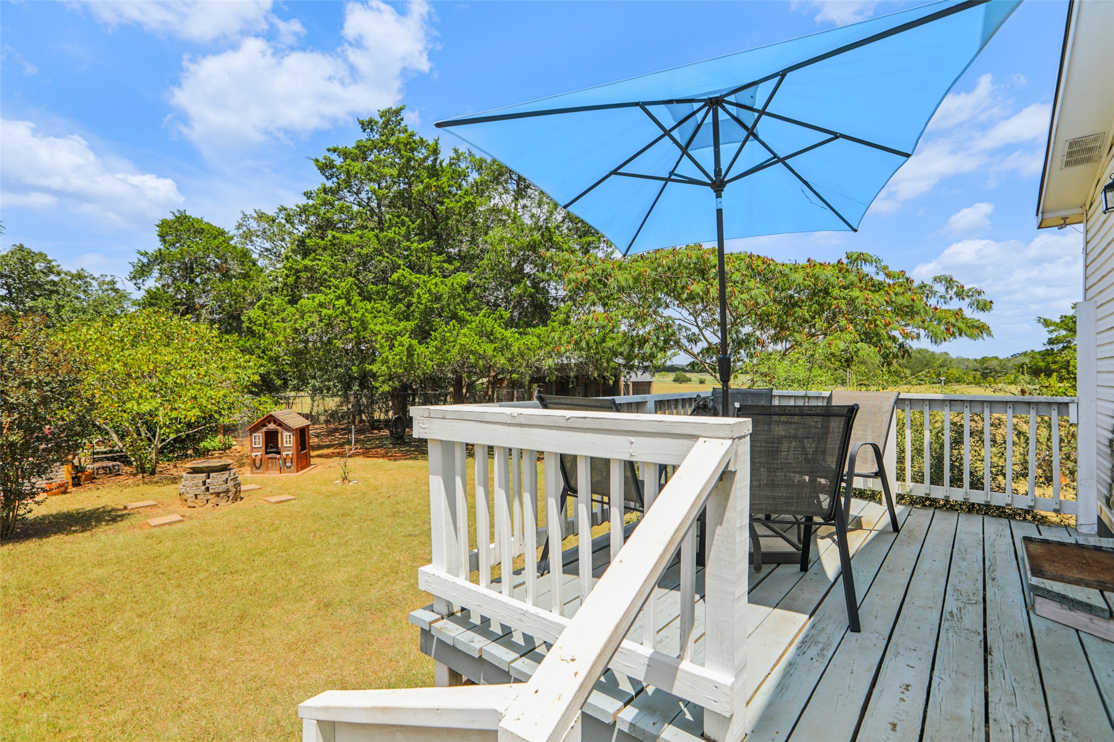 372 Hofferek Road Rosanky, TX 78953 - Photo 29 of 40 Wooden terrace featuring an outbuilding and a yard