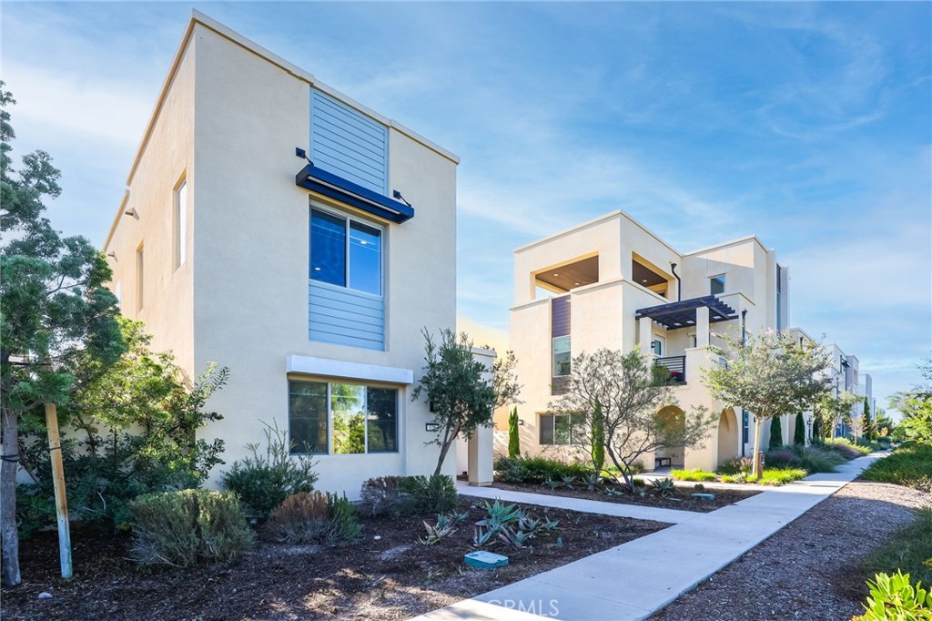 175 Interval Irvine, CA 92618 - Photo 1 of 1 a front view of a house with garden
