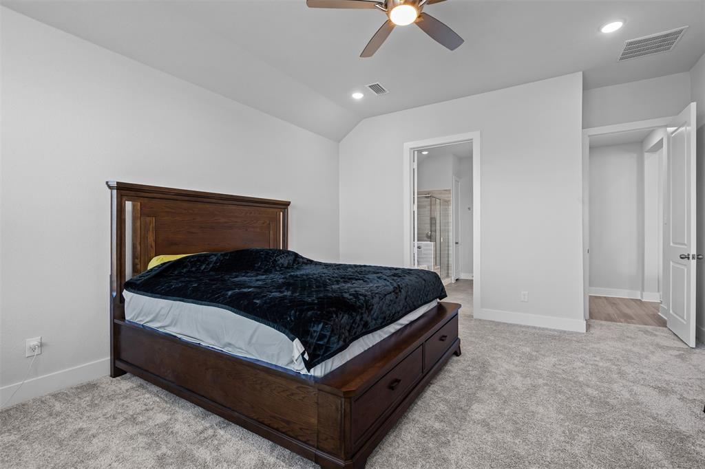 1770 English Way Waxahachie, TX 75165 - Photo 14 of 28 a bedroom with a bed and a ceiling fan