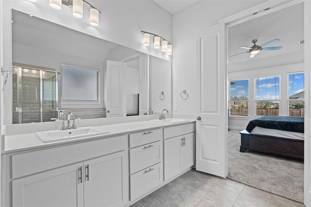 1770 English Way Waxahachie, TX 75165 - Photo 18 of 28 a en suite bathroom with double sink and a large mirror