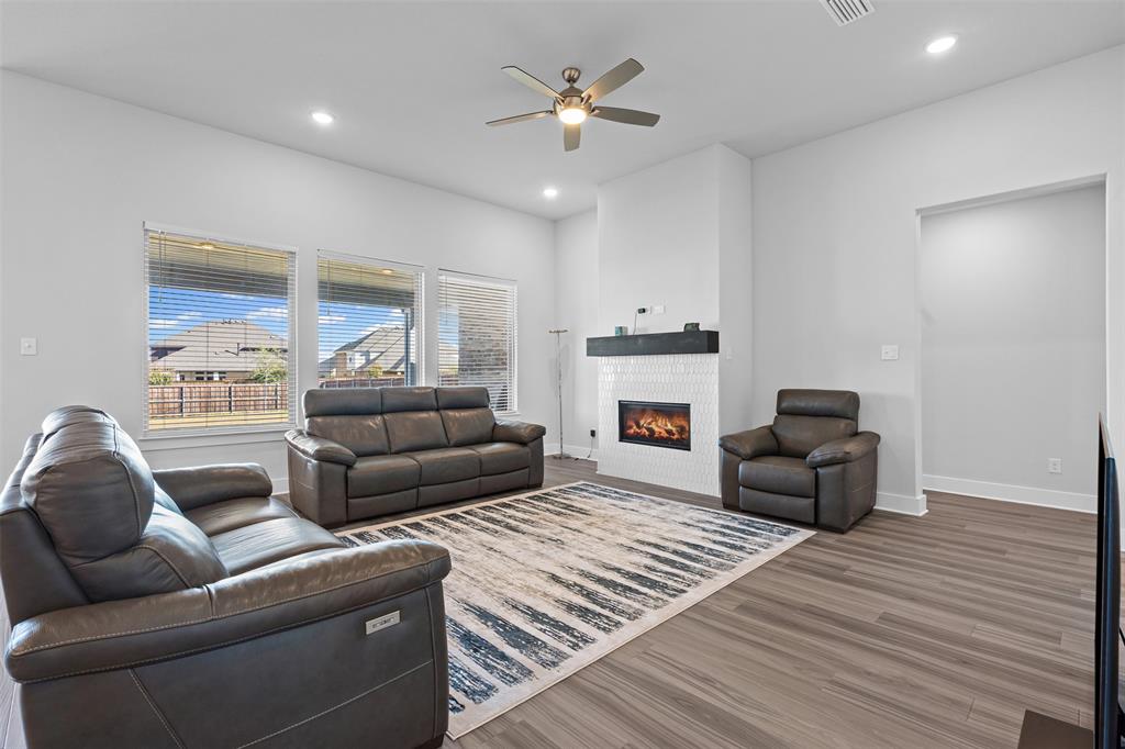 1770 English Way Waxahachie, TX 75165 - Photo 21 of 28 a living room with furniture and a fireplace