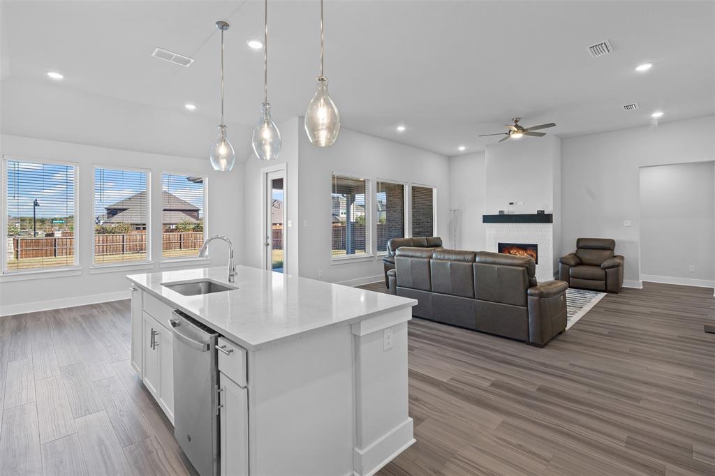 1770 English Way Waxahachie, TX 75165 - Photo 25 of 28 a large kitchen with kitchen island a large island in it