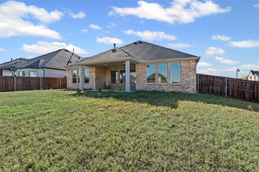 1770 English Way Waxahachie, TX 75165 - Photo 26 of 28 a front view of a house with a garden