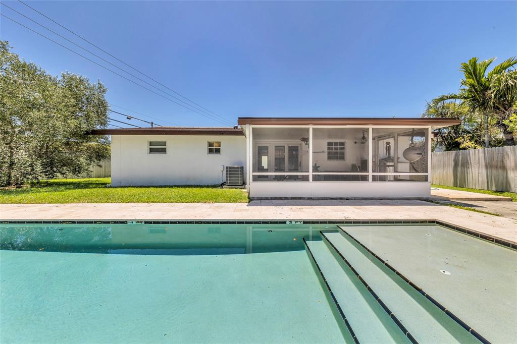 3213 Dover Road Pompano Beach, FL 33062 - Photo 12 of 53 a view of a house with a swimming pool
